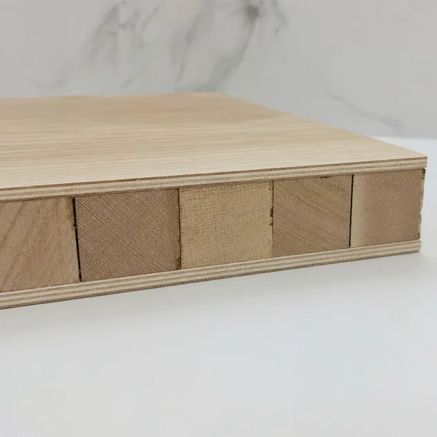 Cross-section of blockboard cabinet board showing solid wood strip core construction with cross-grain veneer layers