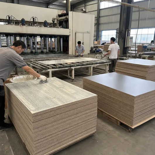HPL laminate bonding secondary hot press operation — adhesive spread and conditioning before trim