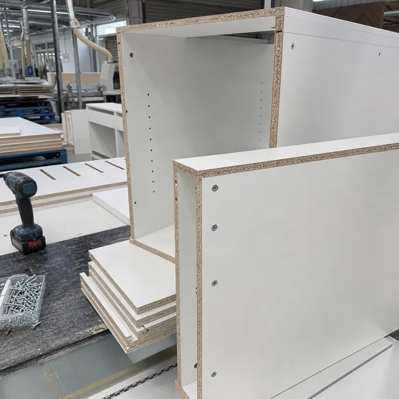 Kitchen cabinet carcass panels made from melamine blockboard showing screw-holding strength