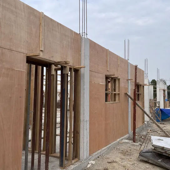 Exterior plywood panels used as concrete formwork on a construction site