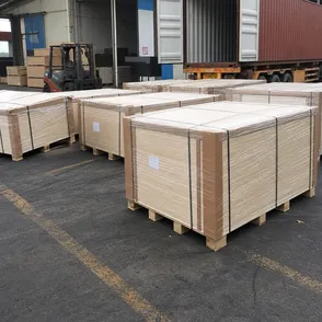 Marine plywood bundles with steel banding, corner boards, and moisture-resistant film wrap ready for container loading