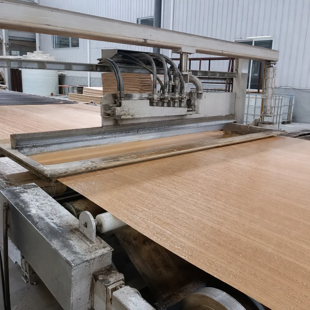 Automated glue spreader applying MR-grade resin to veneer surface
