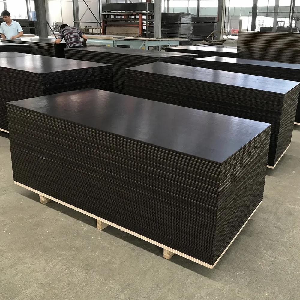 18mm film faced plywood panels stacked at QDPlywood factory — phenolic film surface, formwork grade