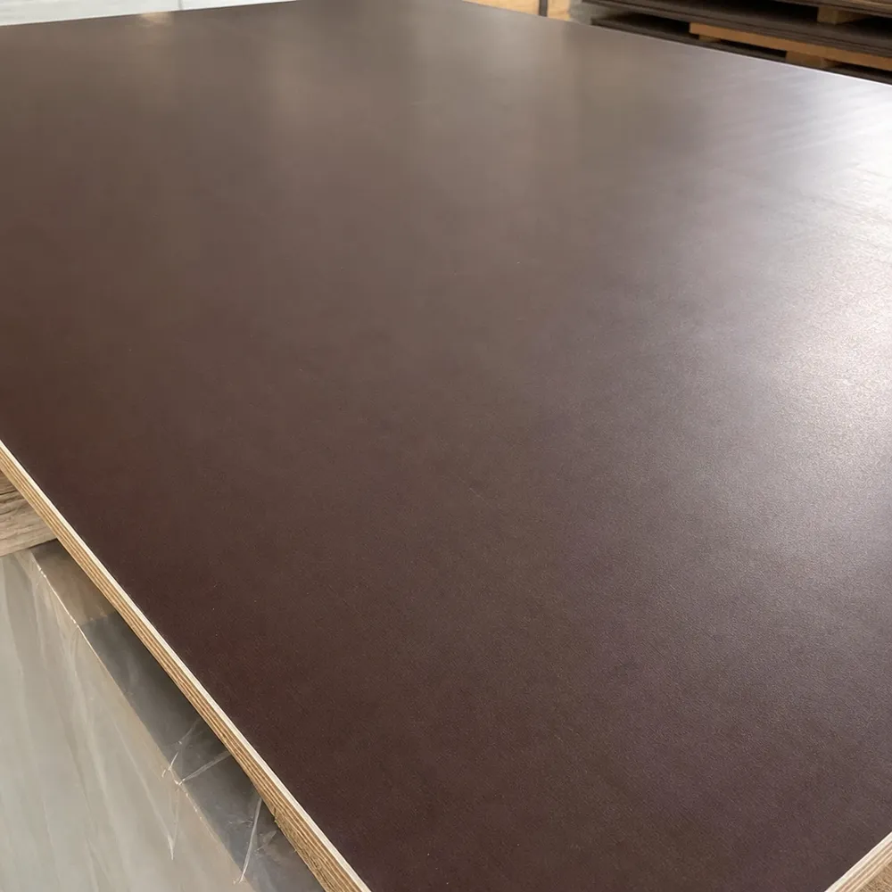Close-up of brown phenolic film surface on formwork plywood — smooth, water-resistant finish