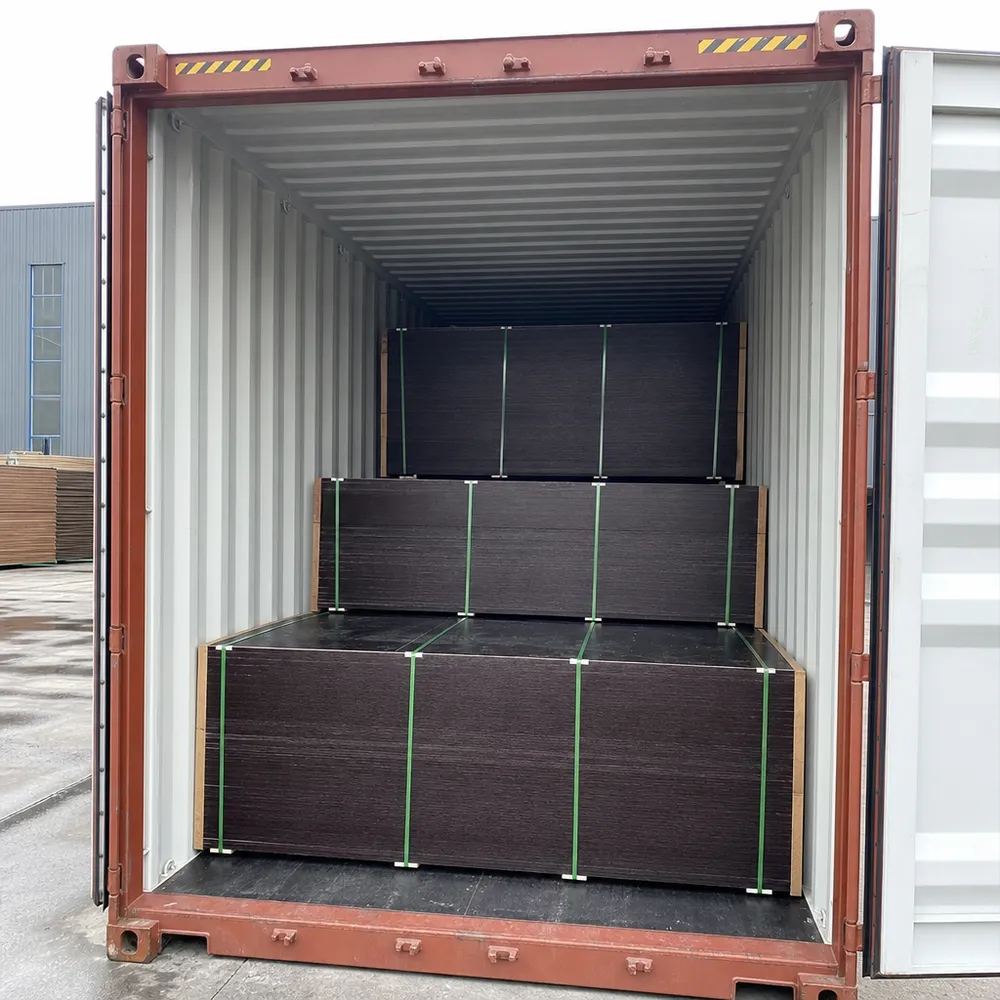 Phenolic film faced plywood panels loaded into a 40HQ container, bundled and strapped for ocean transit