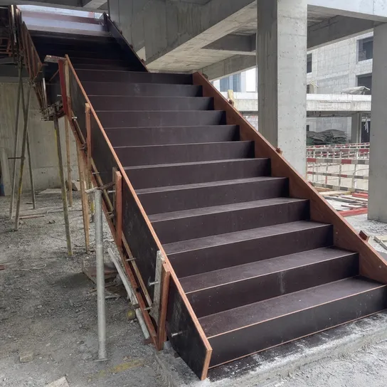 Shuttering film faced plywood forming staircase soffit and riser formwork