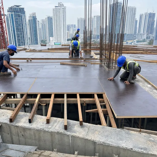 Structural film faced plywood used as concrete formwork on a high-rise construction site