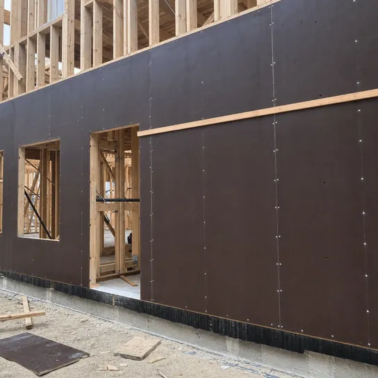 Structural film faced plywood used as shear wall sheathing in timber frame construction