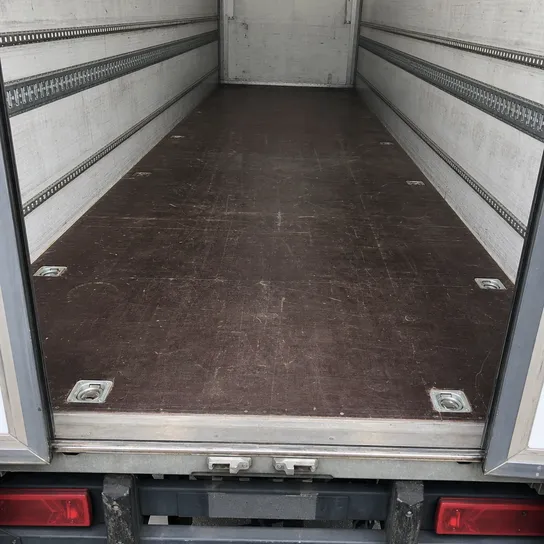 Structural film faced plywood used as truck trailer flooring — heavy transport application