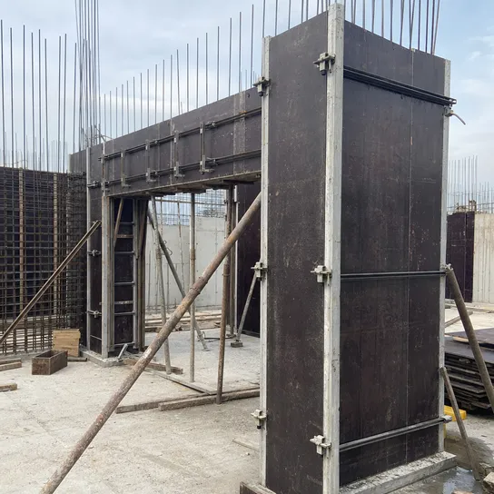 Waterproof film faced plywood used as concrete formwork panels on a construction site