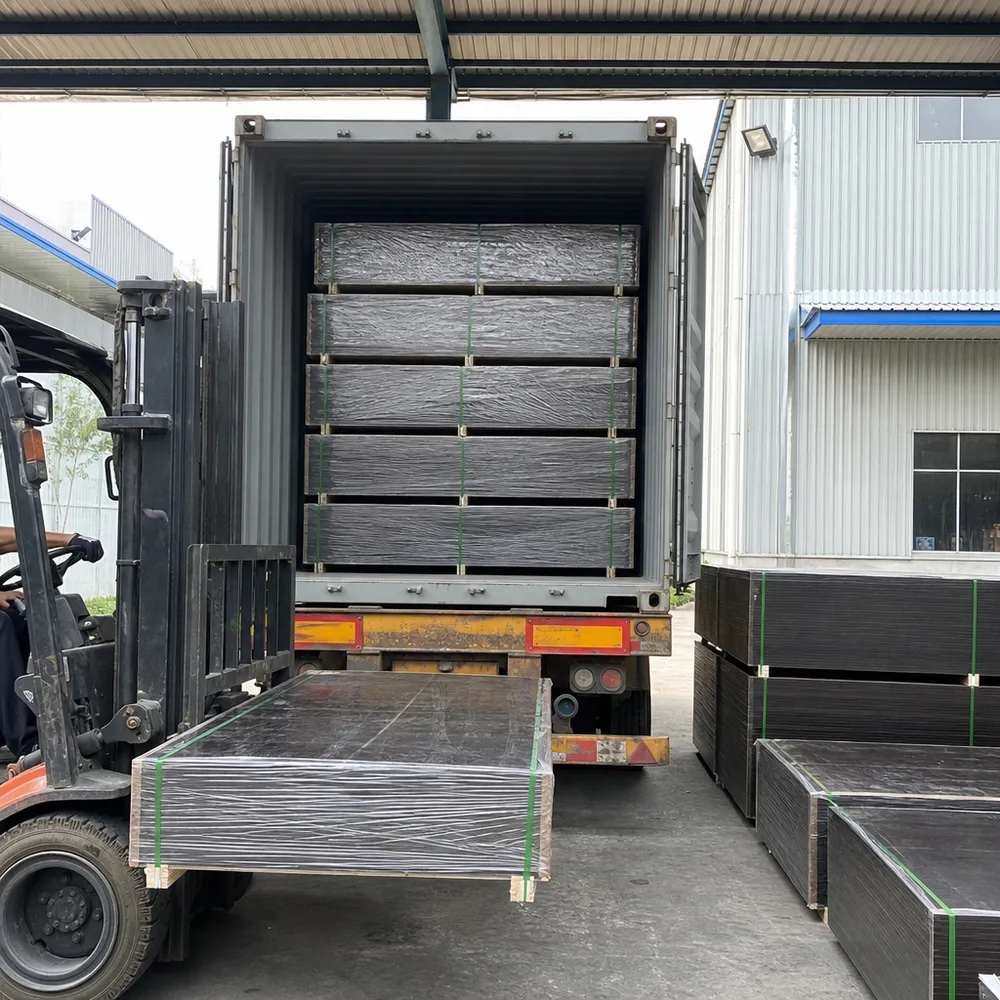 Waterproof film faced plywood panels bundled and loaded into a 40HQ shipping container