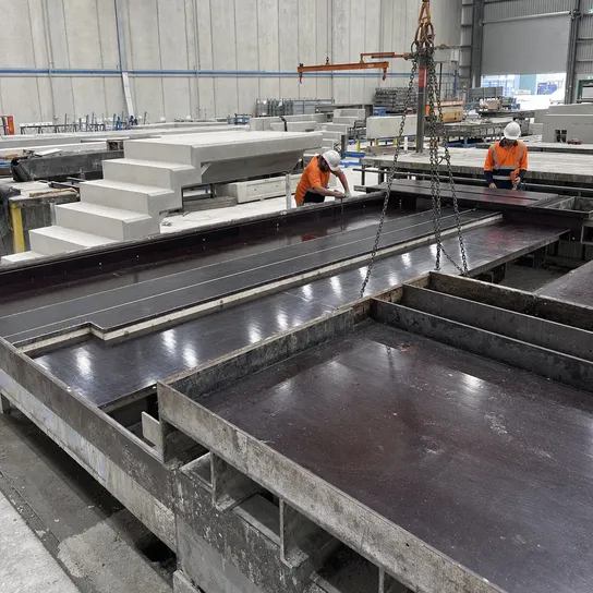 Precast concrete manufacturing factory using film faced plywood form surfaces