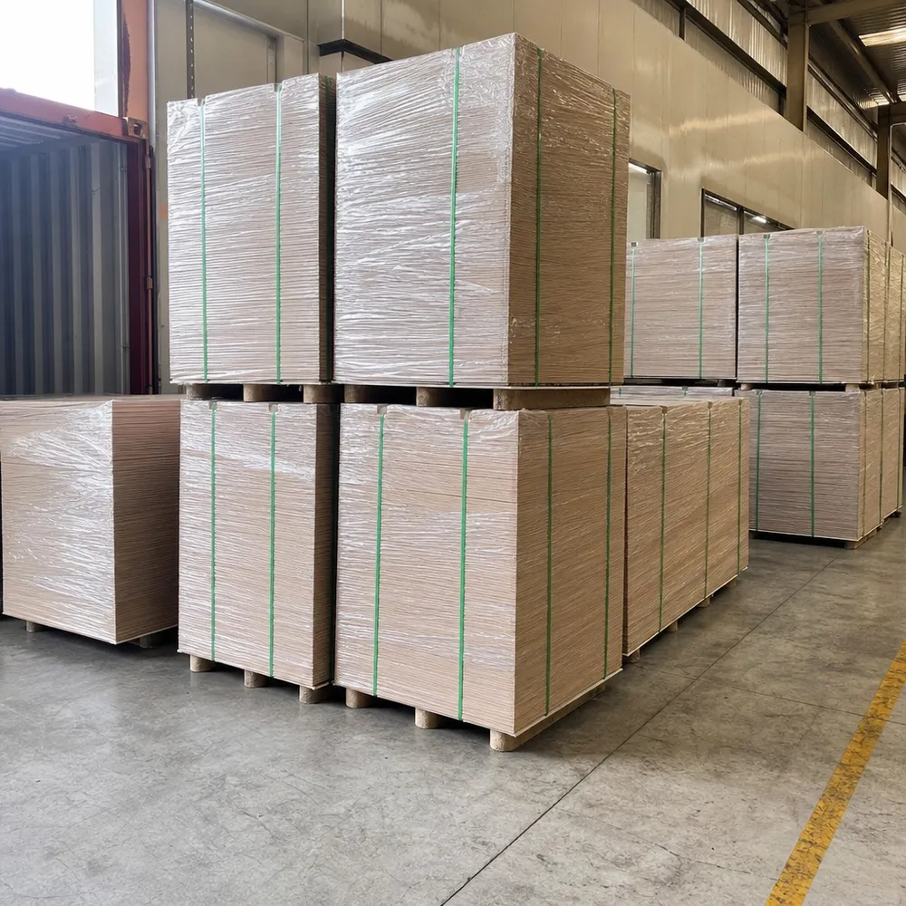 3mm hardboard bundles strapped and wrapped for container loading, showing stacking density