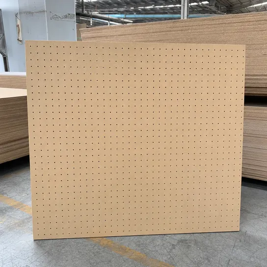 Perforated hardboard pegboard panel — uniform hole grid for tool storage, display, and ventilation applications