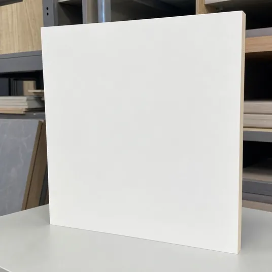Matte solid HPL surface finish on cabinet board — smooth, non-reflective white panel