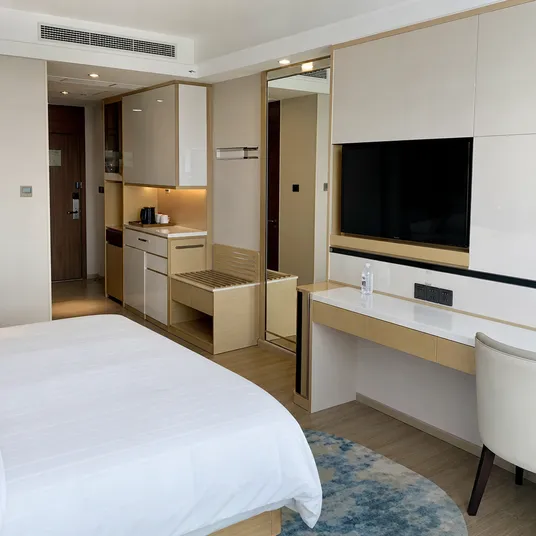 Hotel room joinery and furniture built with glossy melamine plywood