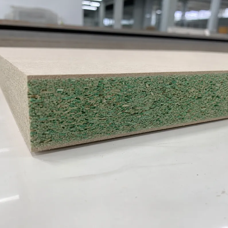 Cross-section of moisture-resistant P5 chipboard particle board showing green-dyed core for grade verification