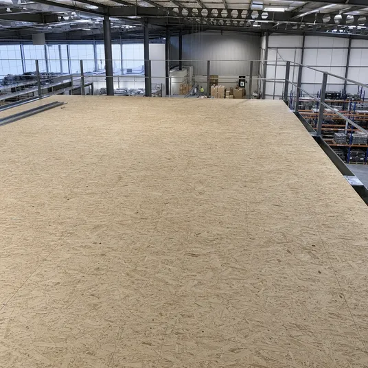 OSB flooring panels forming the deck of a commercial mezzanine floor structure