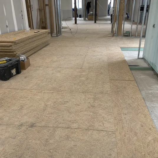 OSB panels used as temporary site flooring and protection during construction
